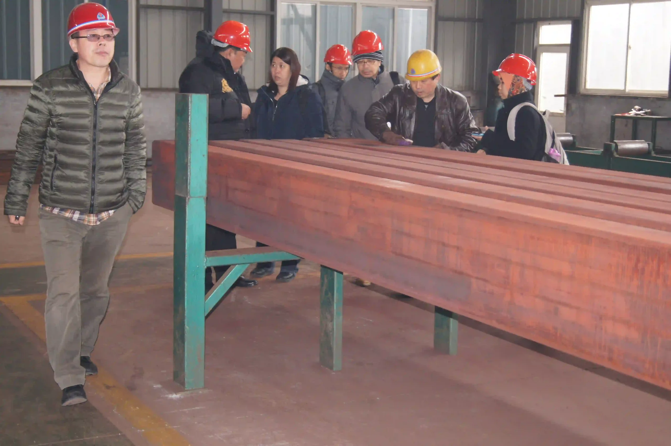 Client inspecting fabricated steel goods before shipment