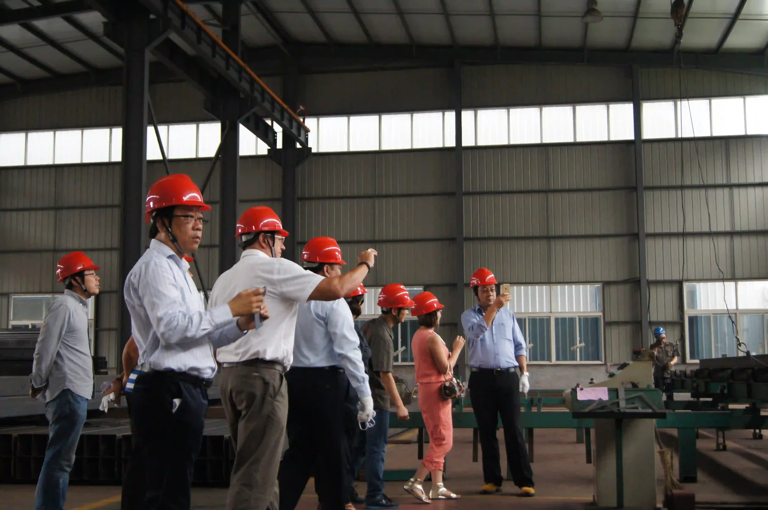 Client engineers observing the welding station during a workshop visit