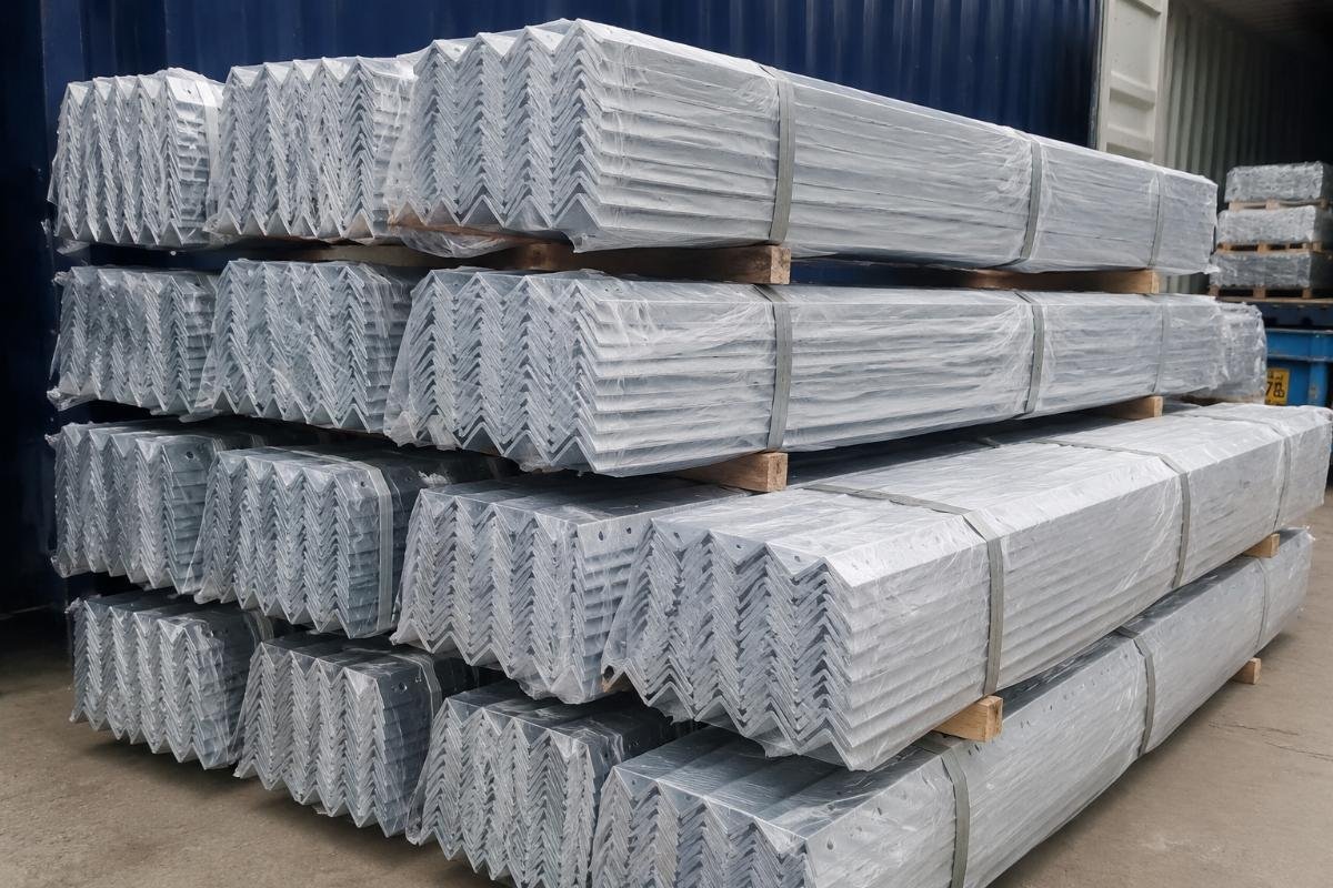 Stack of galvanized angle steel bundles wrapped in protective plastic for sea freight