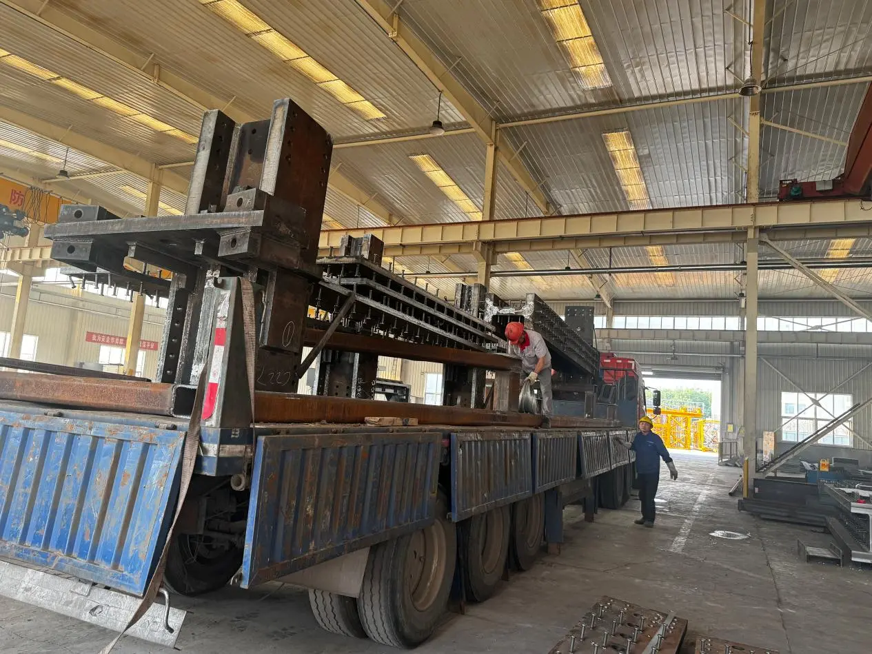 Steel sections and fabricated members stacked inside XJY warehouse ready for industrial plant projects